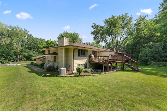 4427 Chatsworth St N, Shoreview, MN 55126 - rear view of property with a yard, a chimney, stairway, a wooden deck, and central AC