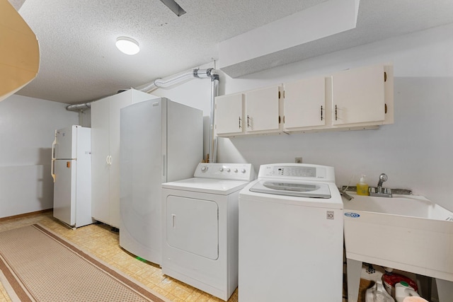 4427 Chatsworth St N, Shoreview, MN 55126 - laundry area featuring cabinet space, independent washer and dryer, and a textured ceiling