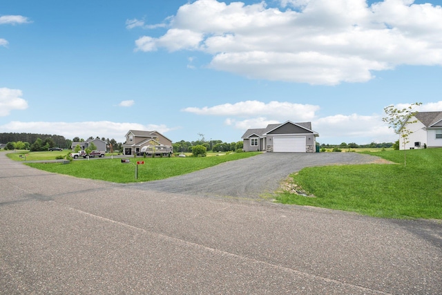 1019 188th St, Garfield Twp, WI 54009 - view of front of house featuring asphalt driveway, a front yard, and an attached garage