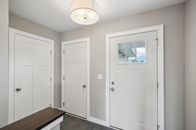 1019 188th St, Garfield Twp, WI 54009 - foyer entrance featuring baseboards and dark colored carpet