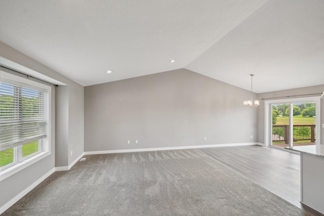 1019 188th St, Garfield Twp, WI 54009 - unfurnished room featuring a chandelier, healthy amount of natural light, lofted ceiling, and recessed lighting