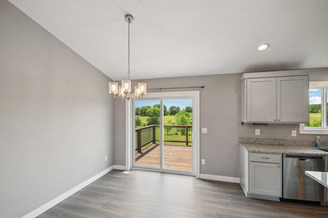 1019 188th St, Garfield Twp, WI 54009 - kitchen featuring stainless steel dishwasher, a chandelier, wood finished floors, recessed lighting, and hanging light fixtures