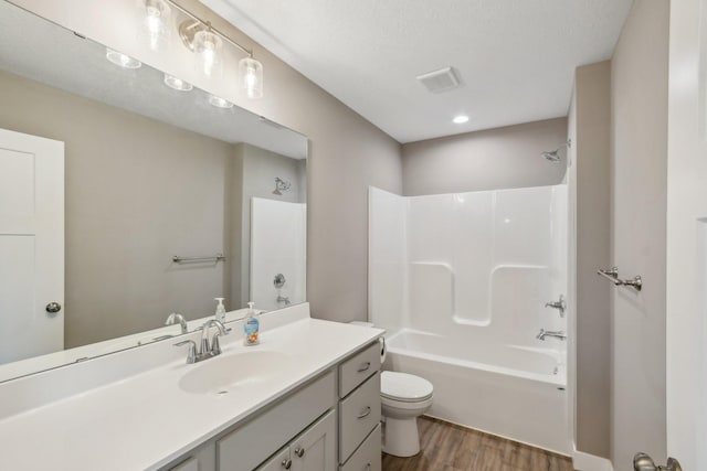 1019 188th St, Garfield Twp, WI 54009 - bathroom with wood finished floors, vanity, and shower / bath combination
