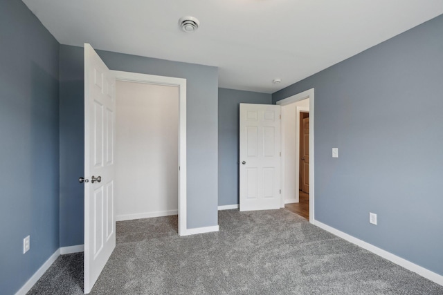 1019 188th St, Garfield Twp, WI 54009 - unfurnished bedroom featuring dark carpet and a closet