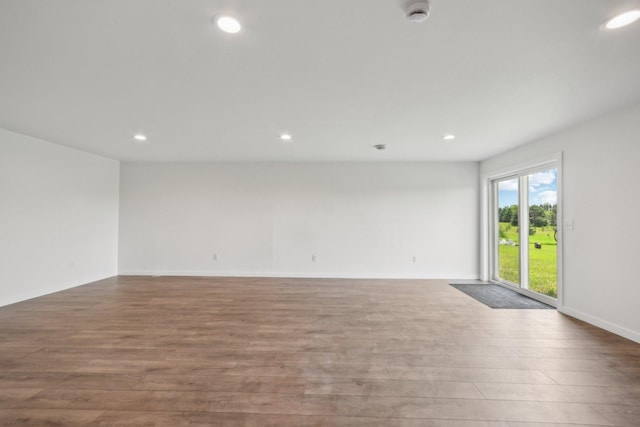 1019 188th St, Garfield Twp, WI 54009 - empty room featuring a smoke detector, recessed lighting, and wood finished floors