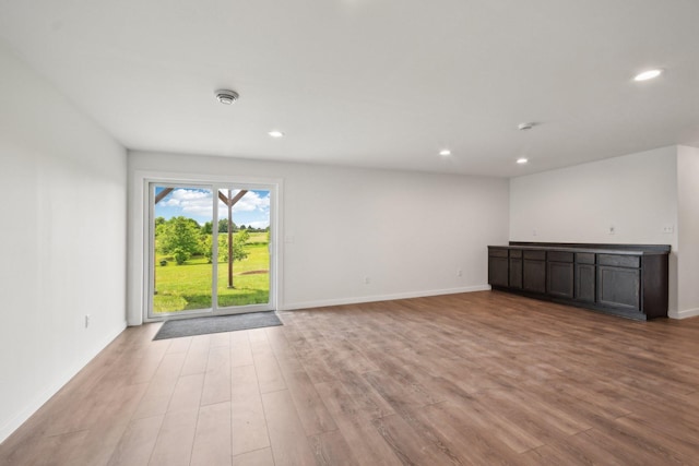 1019 188th St, Garfield Twp, WI 54009 - unfurnished living room featuring light wood-style flooring and recessed lighting
