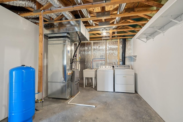 1019 188th St, Garfield Twp, WI 54009 - unfinished below grade area with washer and clothes dryer, a water pressure tank, and heating unit