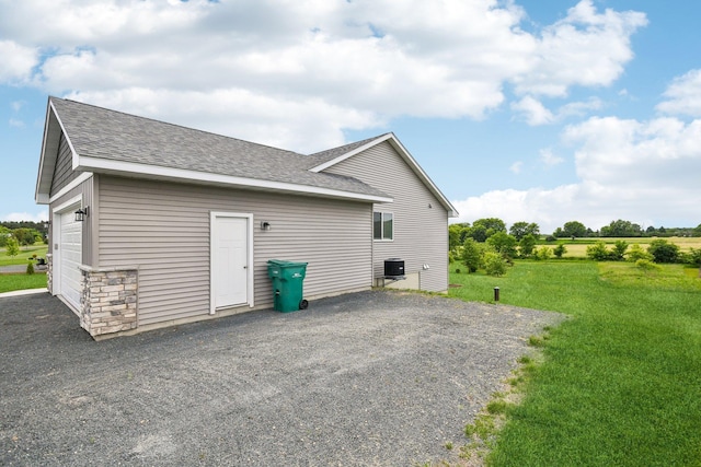 1019 188th St, Garfield Twp, WI 54009 - view of home's exterior with a shingled roof and a yard