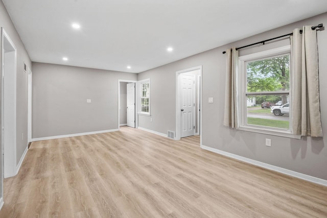 5814 Ewing Ave N, Brooklyn Center, MN 55429 - unfurnished living room featuring recessed lighting and light wood-style floors