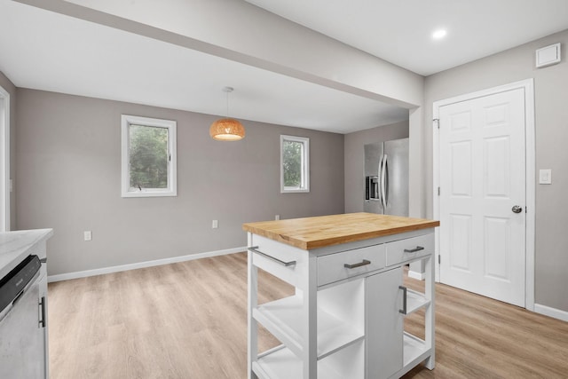 5814 Ewing Ave N, Brooklyn Center, MN 55429 - kitchen featuring appliances with stainless steel finishes, butcher block countertops, light wood-style flooring, plenty of natural light, and recessed lighting