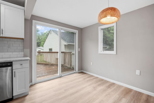 5814 Ewing Ave N, Brooklyn Center, MN 55429 - unfurnished dining area with light wood finished floors