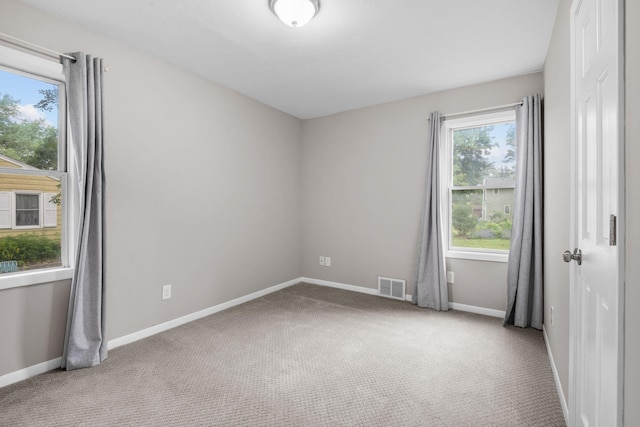5814 Ewing Ave N, Brooklyn Center, MN 55429 - carpeted spare room with baseboards