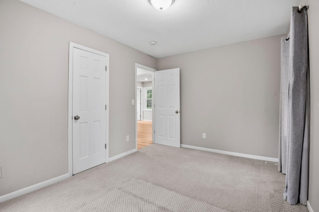 5814 Ewing Ave N, Brooklyn Center, MN 55429 - unfurnished bedroom featuring carpet floors and baseboards