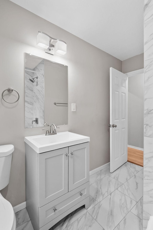 5814 Ewing Ave N, Brooklyn Center, MN 55429 - bathroom with marble look tiles, vanity, and a shower
