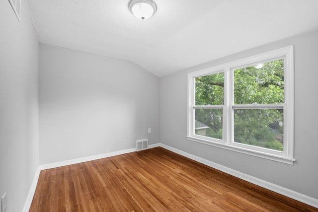 5814 Ewing Ave N, Brooklyn Center, MN 55429 - spare room with lofted ceiling and wood finished floors