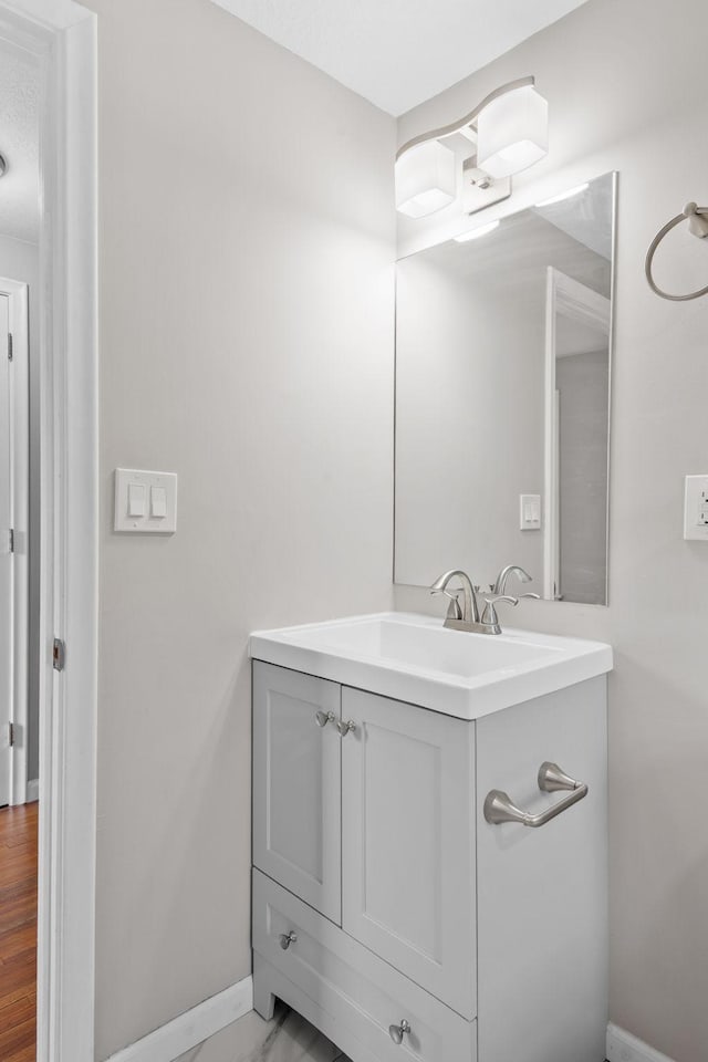 5814 Ewing Ave N, Brooklyn Center, MN 55429 - bathroom with vanity and baseboards