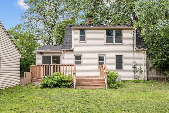 5814 Ewing Ave N, Brooklyn Center, MN 55429 - rear view of house featuring a chimney, a wooden deck, and a shingled roof