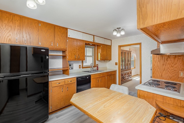 2165 Ross Ave E, Saint Paul, MN 55119 - kitchen featuring a sink, black appliances, extractor fan, and brown cabinets