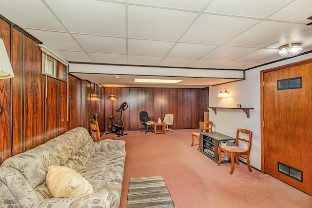2165 Ross Ave E, Saint Paul, MN 55119 - carpeted living room featuring wood walls and a paneled ceiling