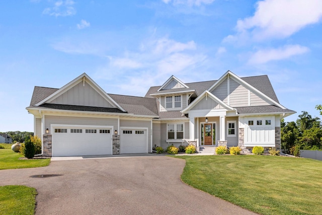 2995 86th St SE, Delano, MN 55328 - craftsman-style house with board and batten siding, driveway, and stone siding
