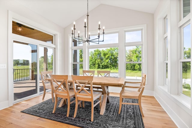 2995 86th St SE, Delano, MN 55328 - dining room featuring lofted ceiling, a chandelier, and light wood-type flooring