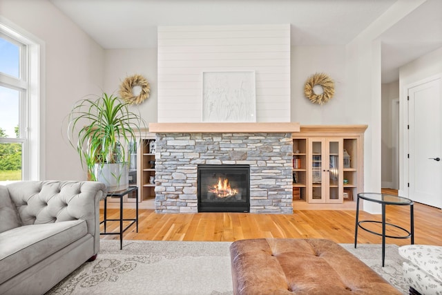 2995 86th St SE, Delano, MN 55328 - living room featuring wood finished floors, healthy amount of natural light, and a fireplace