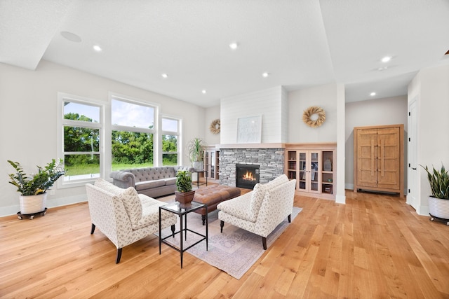 2995 86th St SE, Delano, MN 55328 - living room featuring light wood-type flooring, a fireplace, and recessed lighting