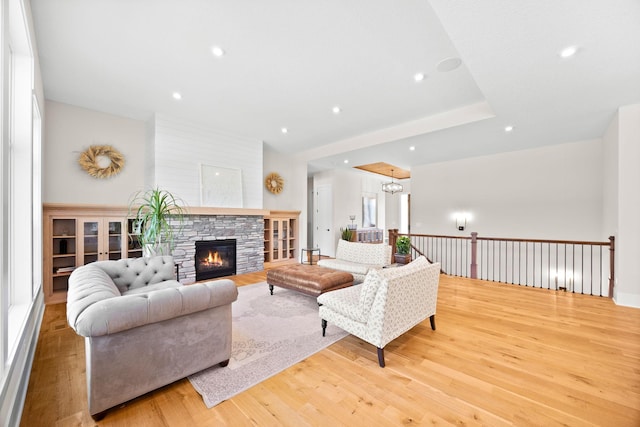 2995 86th St SE, Delano, MN 55328 - living area with wood finished floors, recessed lighting, a fireplace, and a chandelier