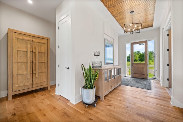 2995 86th St SE, Delano, MN 55328 - foyer featuring light wood finished floors, a chandelier, wooden ceiling, and recessed lighting