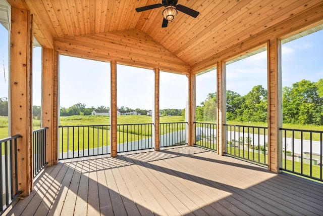 2995 86th St SE, Delano, MN 55328 - unfurnished sunroom with lofted ceiling, a ceiling fan, and view of scattered trees