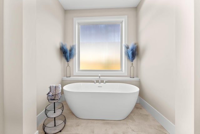 2995 86th St SE, Delano, MN 55328 - bathroom featuring a freestanding tub and tile patterned floors