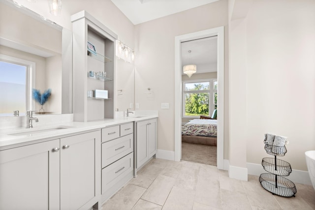2995 86th St SE, Delano, MN 55328 - full bathroom featuring double vanity, a freestanding tub, and ensuite bath