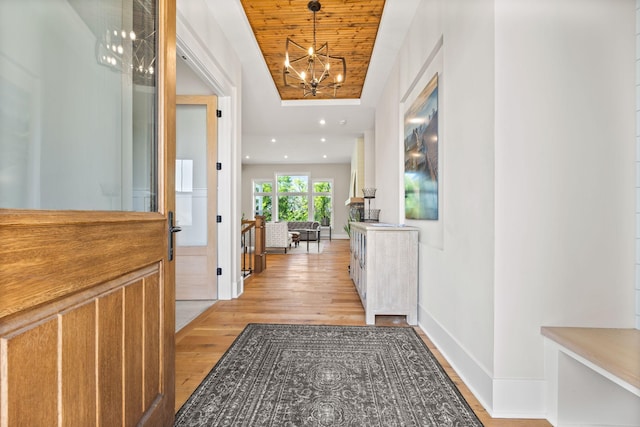 2995 86th St SE, Delano, MN 55328 - hall featuring a chandelier and light wood finished floors