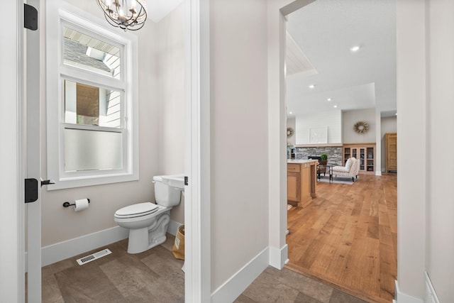 2995 86th St SE, Delano, MN 55328 - bathroom with tasteful backsplash, a chandelier, and vanity