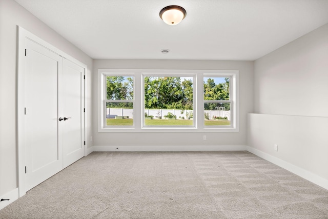 2995 86th St SE, Delano, MN 55328 - spare room featuring light carpet and baseboards