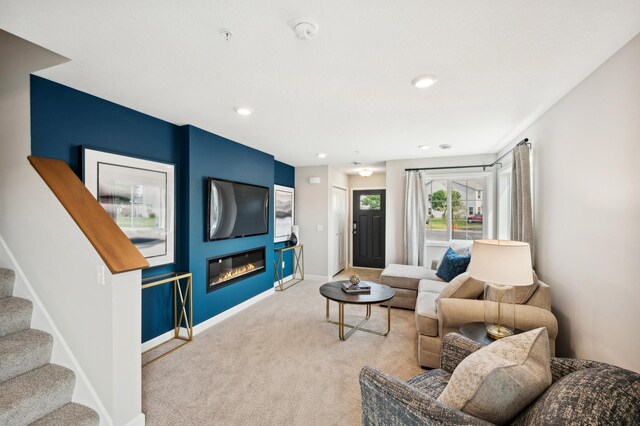 25552 3rd St W, Zimmerman, MN 55398 - carpeted living room featuring stairway, baseboards, a glass covered fireplace, and recessed lighting
