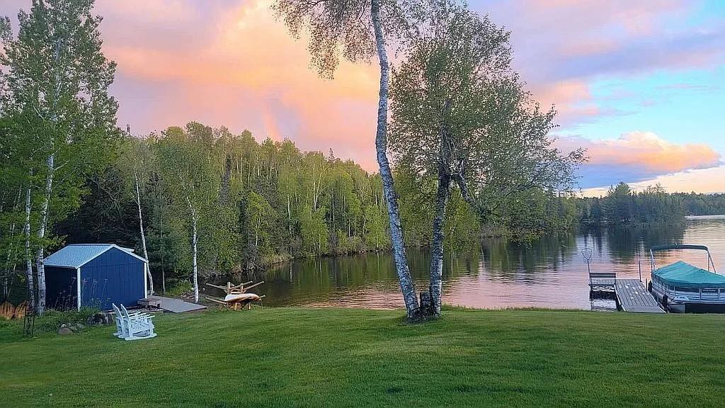 5226 Pontoon Bay Rd, Duluth, MN 55803 - water view with a boat dock and a heavily wooded area