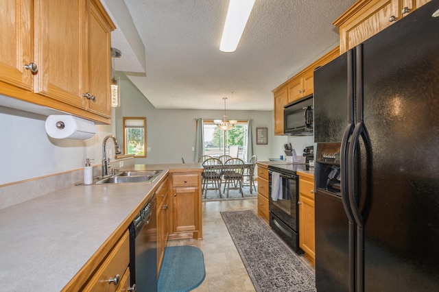 14754 Peridot St NW, Ramsey, MN 55303 - kitchen with black appliances, a sink, a peninsula, light countertops, and a textured ceiling