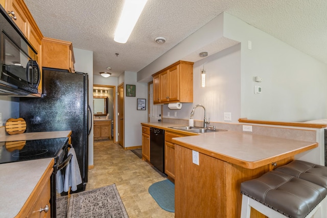 14754 Peridot St NW, Ramsey, MN 55303 - kitchen with a sink, black appliances, a peninsula, a textured ceiling, and a breakfast bar
