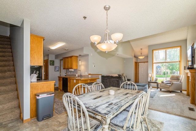 14754 Peridot St NW, Ramsey, MN 55303 - dining space featuring stairway, a chandelier, and a textured ceiling