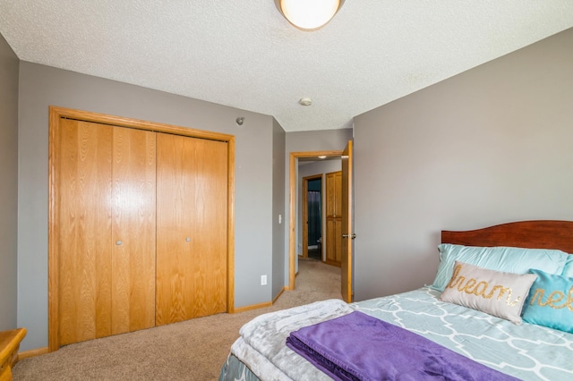 14754 Peridot St NW, Ramsey, MN 55303 - carpeted bedroom with a closet, a textured ceiling, and baseboards