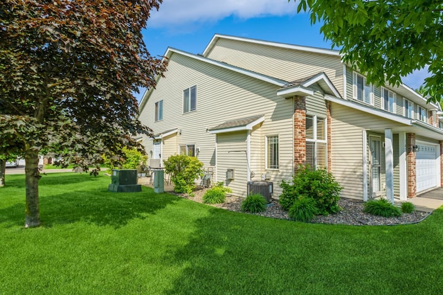 14754 Peridot St NW, Ramsey, MN 55303 - view of side of property with central AC and a yard