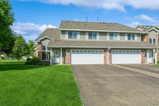 14754 Peridot St NW, Ramsey, MN 55303 - multi unit property featuring driveway, an attached garage, a front lawn, and brick siding