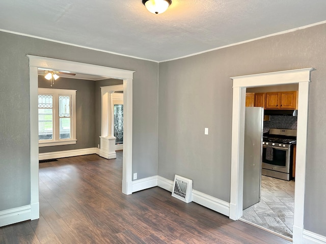 803 Jefferson Ave, Albert Lea, MN 56007 - spare room with wood finished floors, baseboards, a ceiling fan, and crown molding