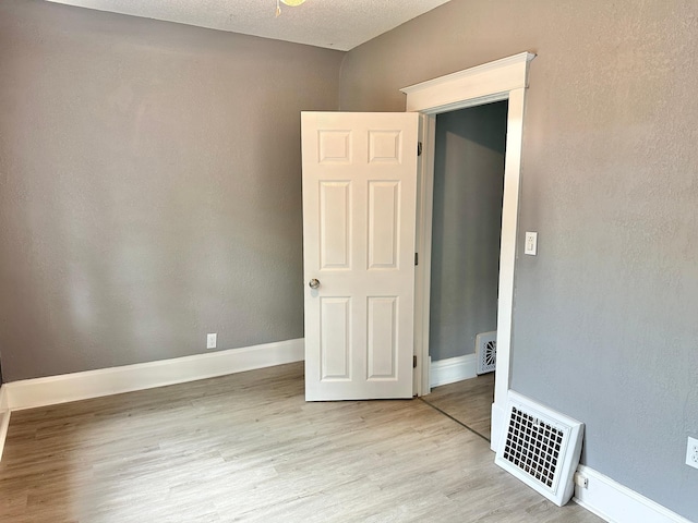 803 Jefferson Ave, Albert Lea, MN 56007 - spare room featuring wood finished floors and baseboards