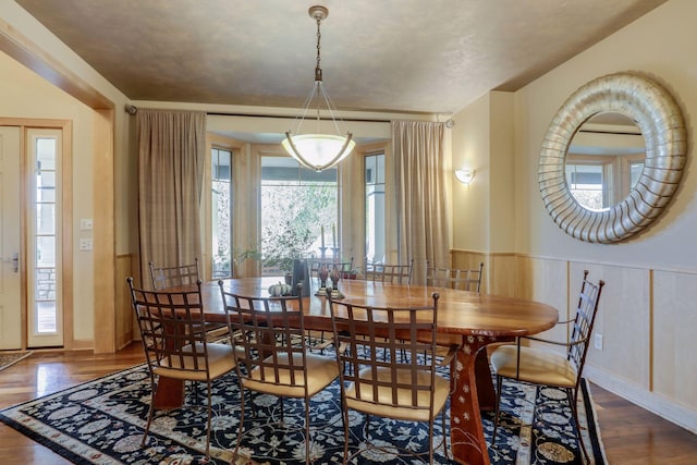 10025 Adam Ave, Inver Grove Heights, MN 55077 - dining area with wood finished floors and wainscoting