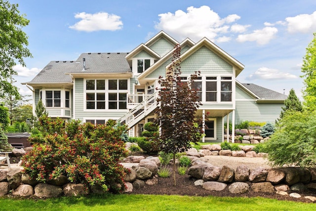10025 Adam Ave, Inver Grove Heights, MN 55077 - back of house featuring stairway, a sunroom, and a deck