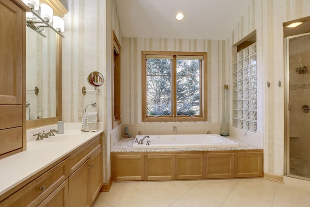 10025 Adam Ave, Inver Grove Heights, MN 55077 - bathroom featuring wallpapered walls, vanity, a shower stall, a bath, and tile patterned floors