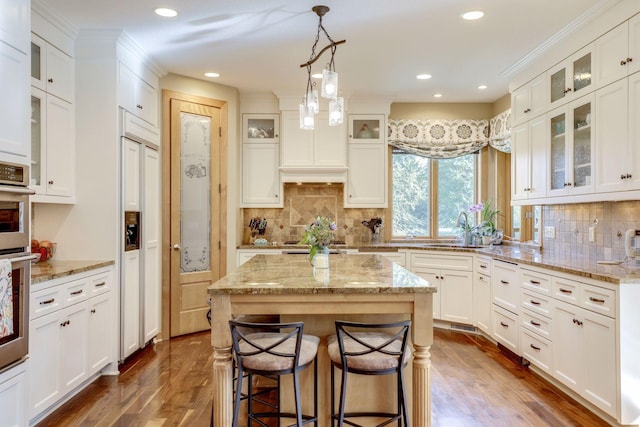 10025 Adam Ave, Inver Grove Heights, MN 55077 - kitchen with white cabinets, dark wood-style flooring, recessed lighting, and crown molding