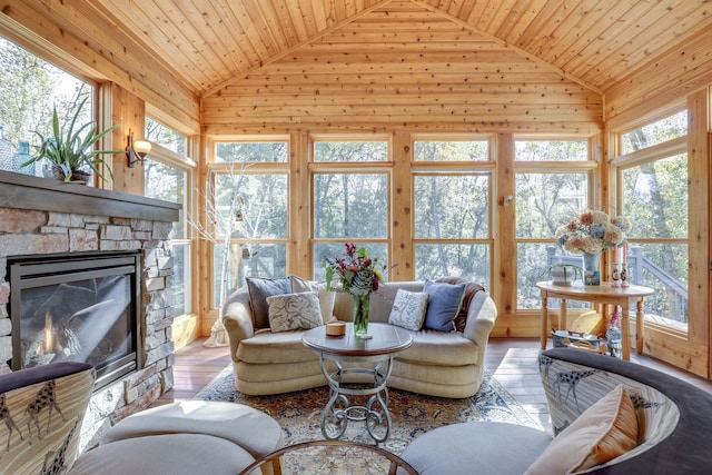 10025 Adam Ave, Inver Grove Heights, MN 55077 - living room with lofted ceiling, wood ceiling, wood finished floors, a fireplace, and wood walls